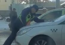Таксист прокатил на капоте патрульного. На водителя завели дело