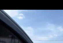 Эки бутун терезеден чыгарып алып, унаа башкарган айдоочунун видеосу